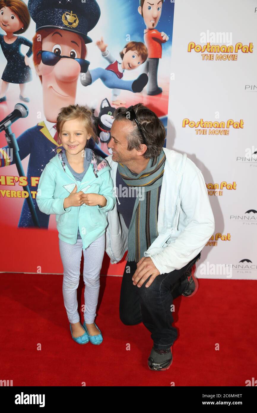 Australian actor Ian Stenlake and daughter Tahlula on the red carpet at the Postman Pat movie at Hoyts Entertainment Quarter, Moore Park in Sydney. Stock Photo