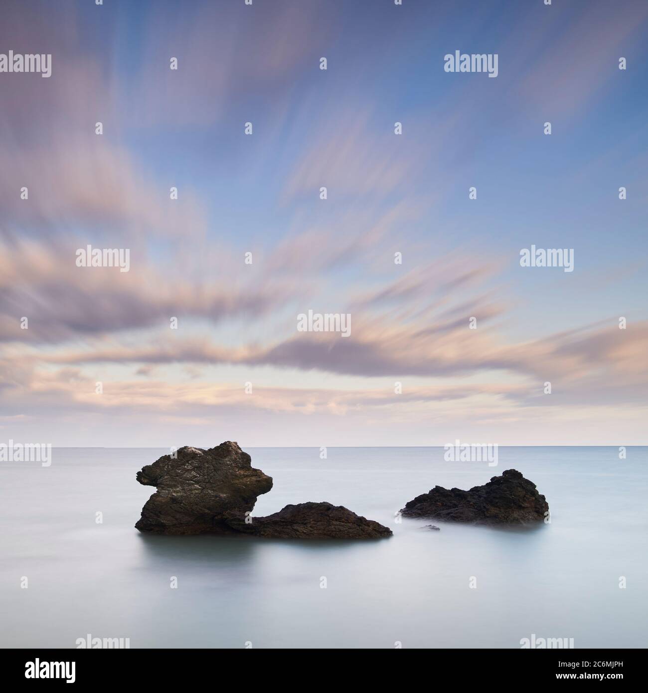 Long exposure shot of sea stacks and clouds in the morning, Mie Prefecture, Japan Stock Photo