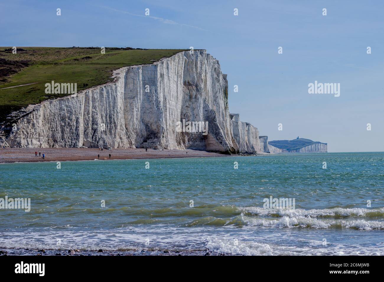 The Seven Sisters are a series of chalk cliffs by the English Channel. They form part of the South Downs in East Sussex, between the towns of Seaford Stock Photo