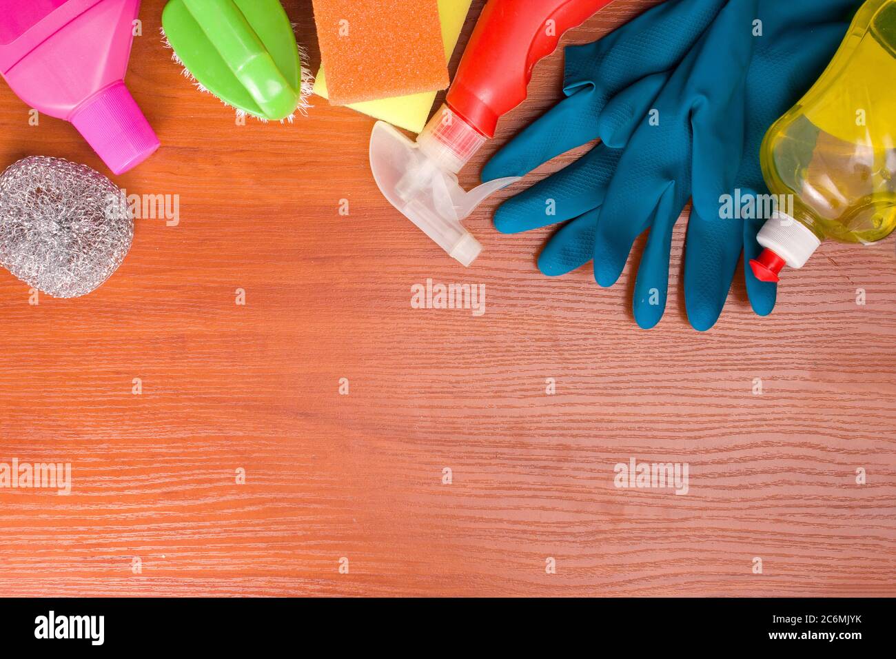 Set for cleaning various surfaces in the kitchen, bathroom and other areas. Copyspace for text or logo on a wooden background. The concept of cleaning services, house cleaning Flat lay Stock Photo