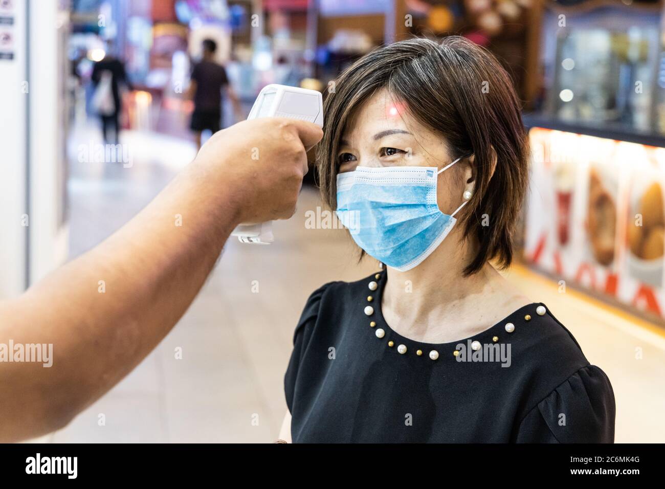 New normal requiring shopper wear mask and scan with thermometer for ...