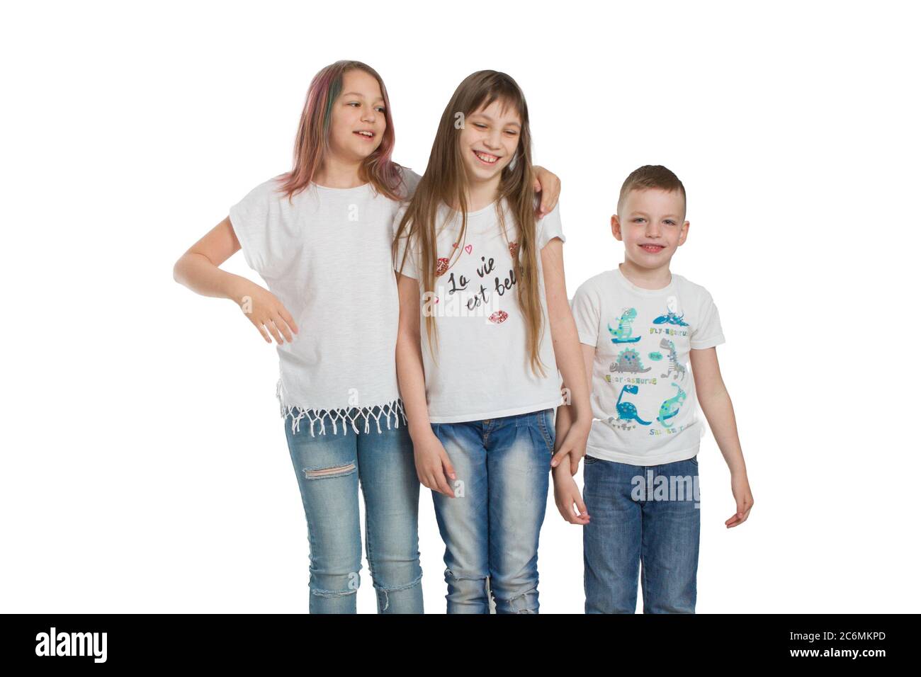children in t-shirts and jeans isolated on white. Friends or brothers and  sisters Stock Photo - Alamy