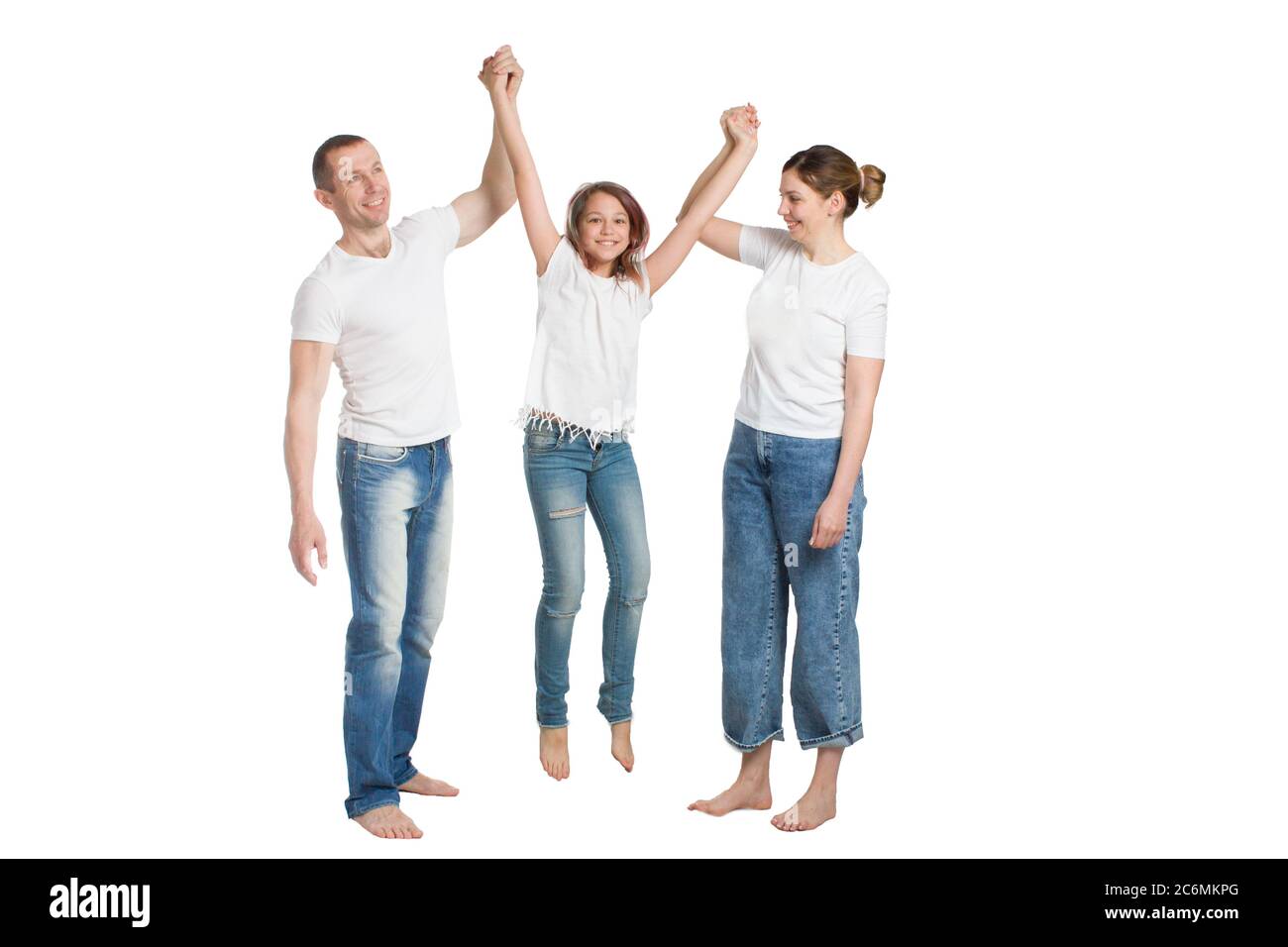 family mom, dad and son, in casual clothing, isolated on a white background Stock Photo