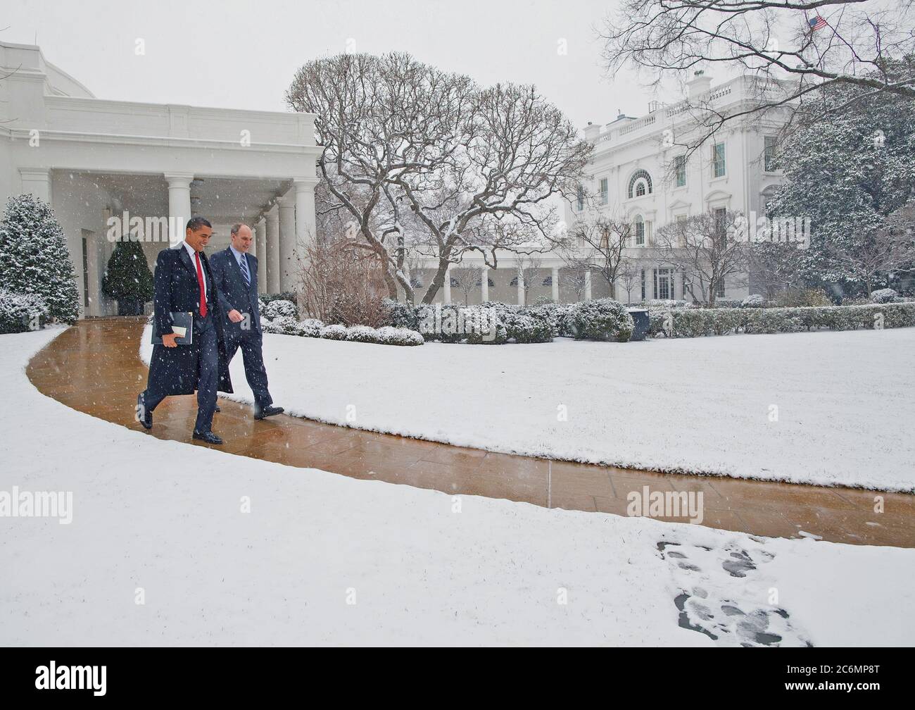 President Barack Obama leaves the White House with his Legislative Affairs Director Phil Shiliro en route the U.S. Capitol to meet with  Republican members of Congress, 1/27/09. Stock Photo