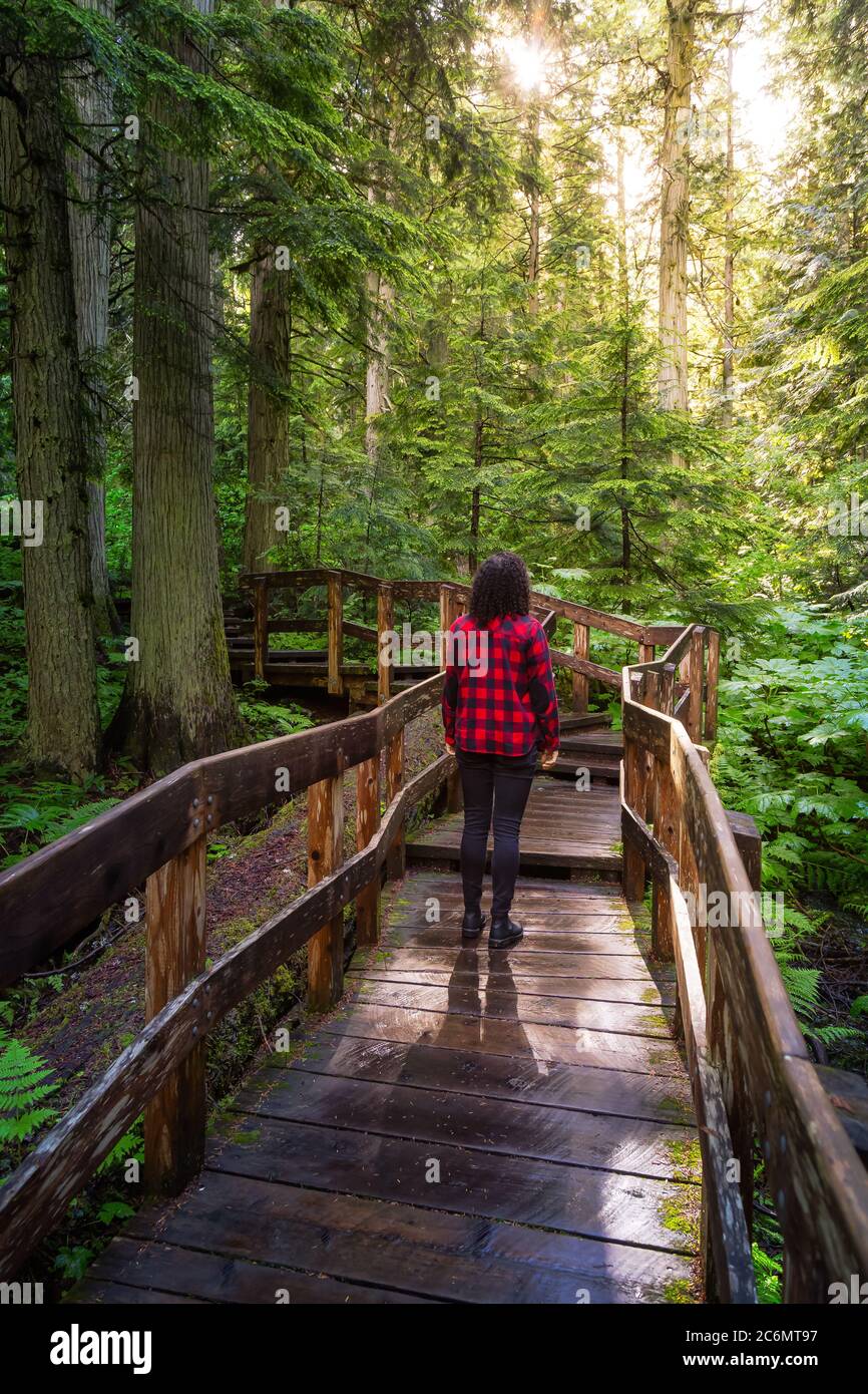 Girl Hiking in Rain Forest Stock Photo - Alamy