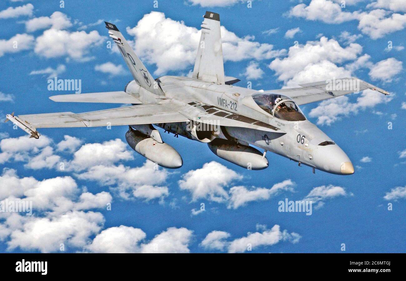 US Marine Corps (USMC) Captain (CAPT) Kevin Reece, Marine Aviator for Vertical Marine Fighter Attack Squadron 212 (VMFA-212), pilots his F/A18 Hornet over the South China Sea Stock Photo