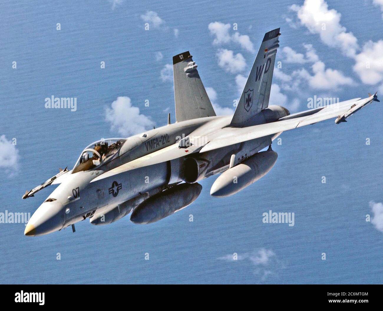 A Marine Aviator for Vertical Marine Fighter Attack Squadron 212 (VMFA-212), pilots his F/A18 Hornet over the South China Sea Stock Photo