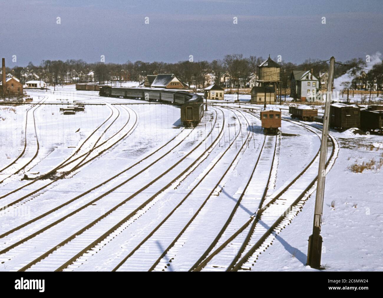 Train and several sets of railroad tracks in the snow, Massachusetts ...