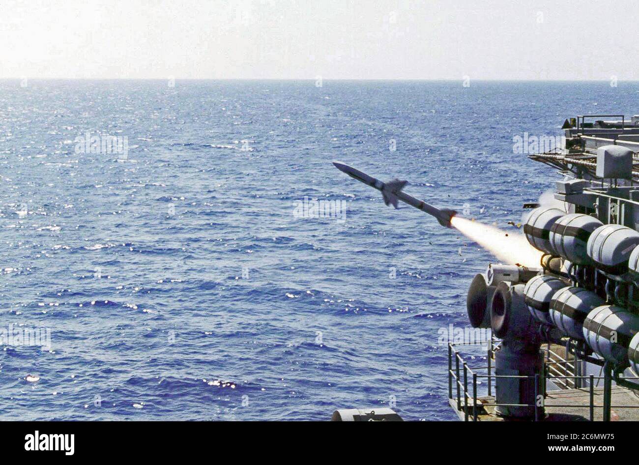 While underway in the Philippine Sea, a RIM-7 Sea Sparrow is launched from the aircraft carrier USS KITTY HAWK (CV 63) in support of an Anti-Ship Cruise Missile Exercise. Stock Photo