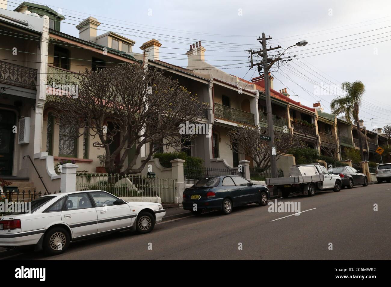 Terraced houses on a hill in Wigram Road, Forest Lodge in Sydney’s inner west, just before sunset. Stock Photo