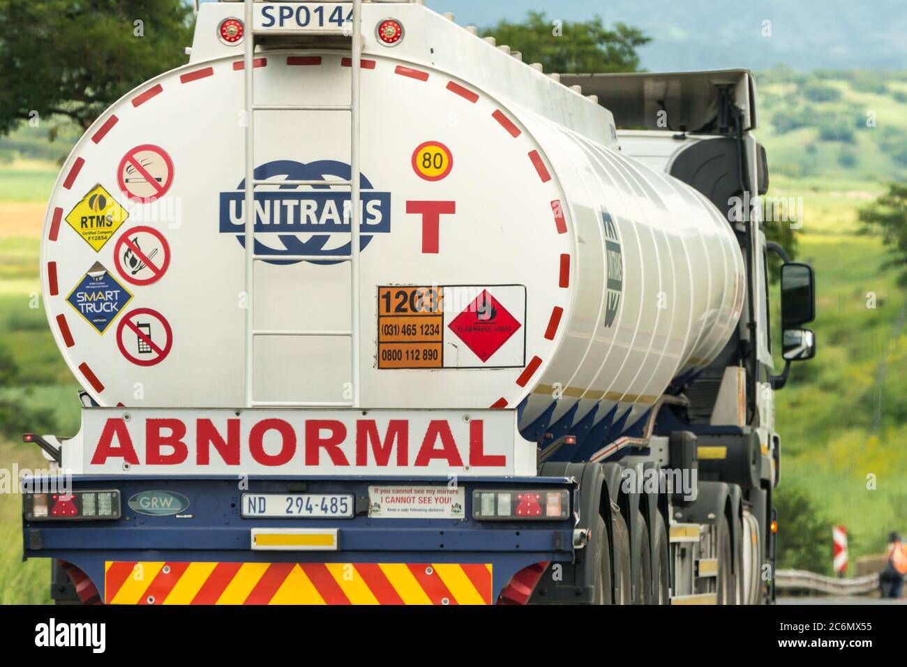 closeup of an abnormal load, a tanker carrying flammable liquid on a road in South Africa Stock Photo