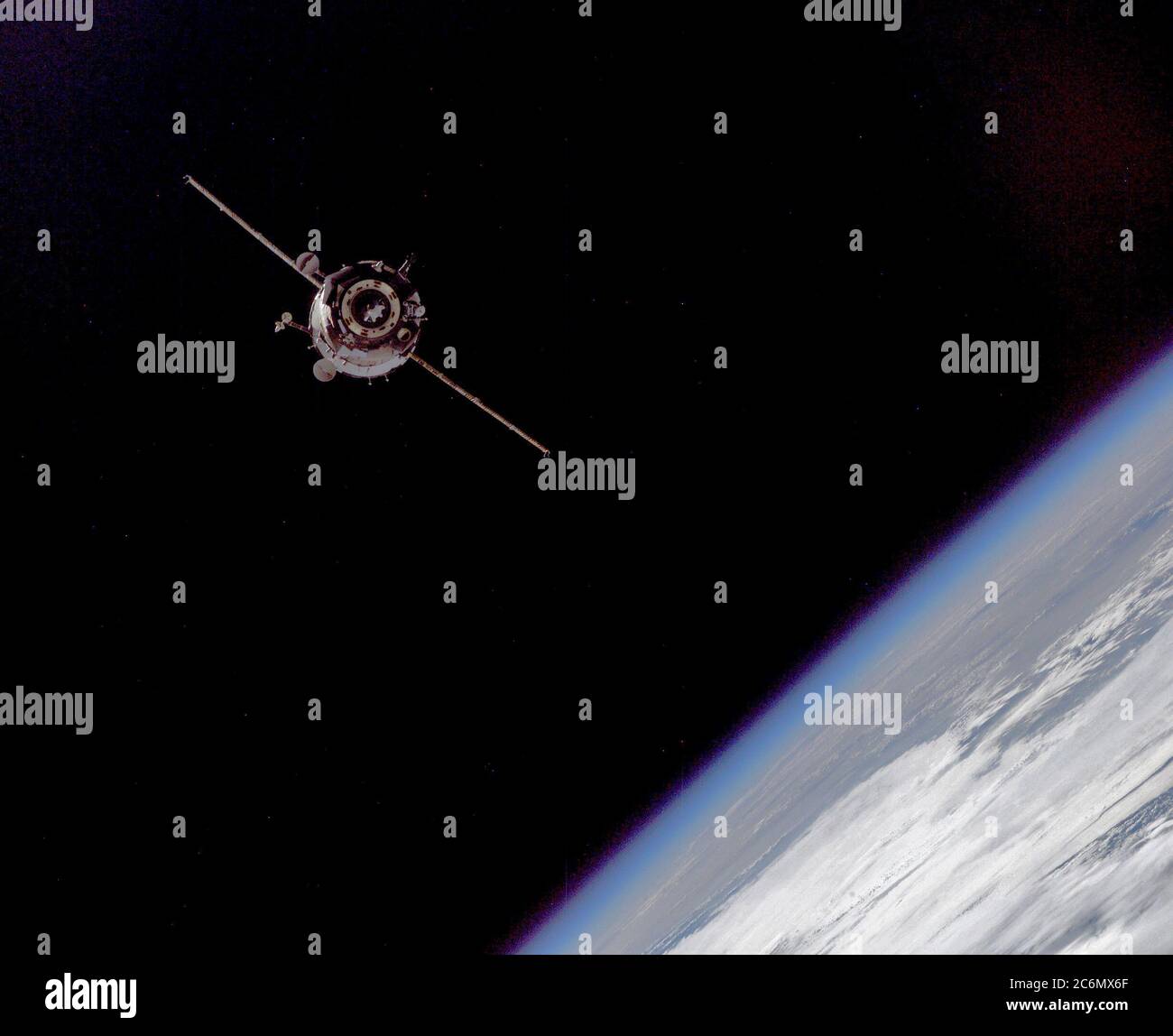 This picture of a distant Soyuz TMA-3 spacecraft was recorded by one of the Expedition 7 crewmembers aboard the International Space Station (ISS). Stock Photo