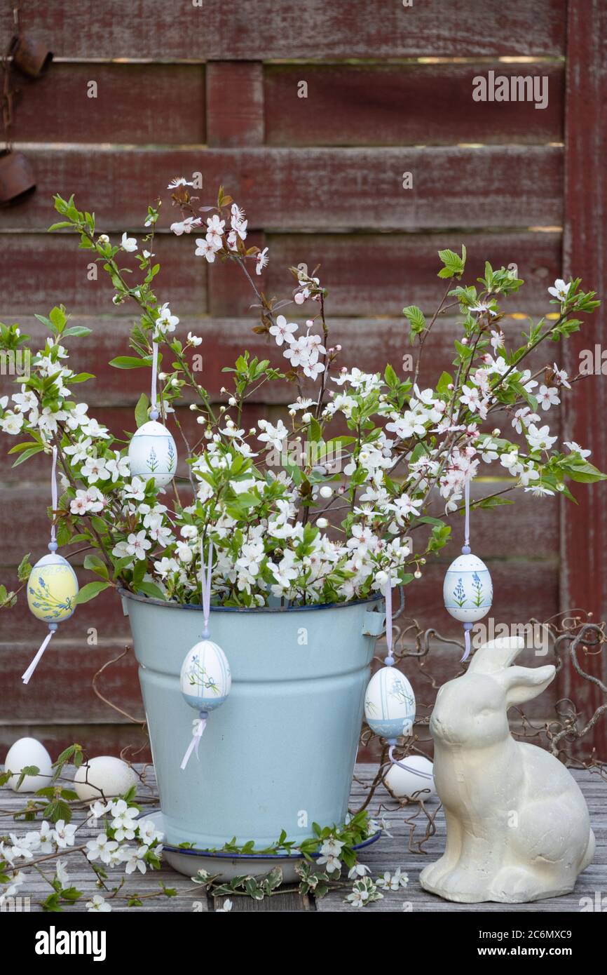 easter decoration with bloomong branches, easter eggs and easter bunny Stock Photo