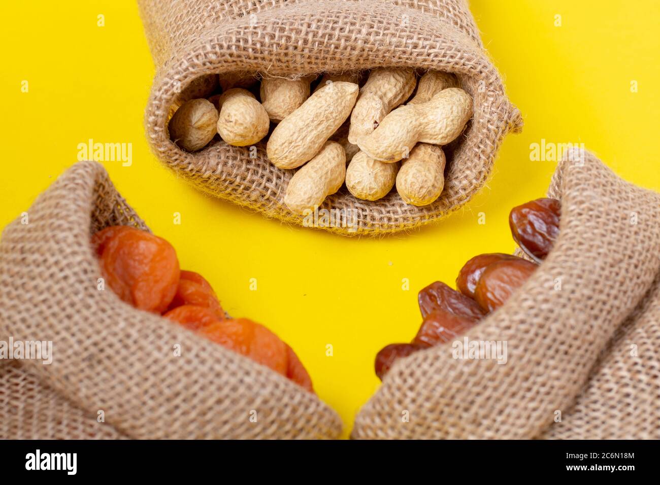 Vegan snaacks, dessert in burlap sacks, Flat lay Stock Photo