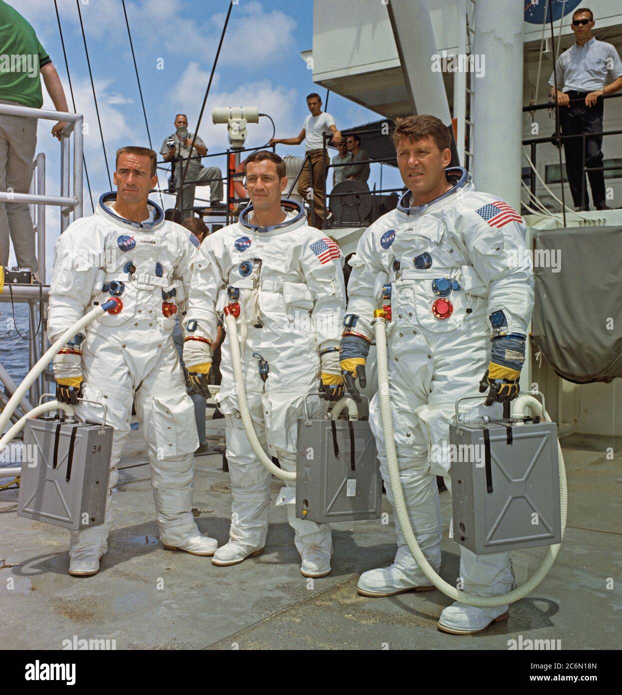 (5 Aug. 1968) --- The prime crew of the first manned Apollo space mission, Apollo 7, stands on the deck of the NASA Motor Vessel Retriever after suiting up for water egress training Stock Photo
