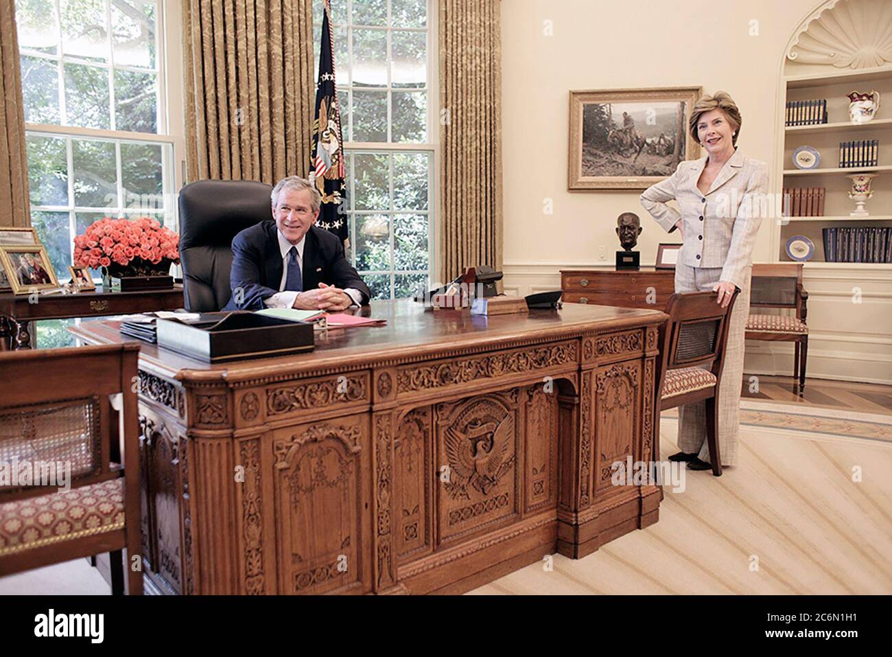 Mrs. Laura Bush joins President George W. Bush in the Oval Office of the White House, May 31, 2005.  Photo by Eric Draper, Courtesy of the George W. Bush Presidential Library and Museum Stock Photo