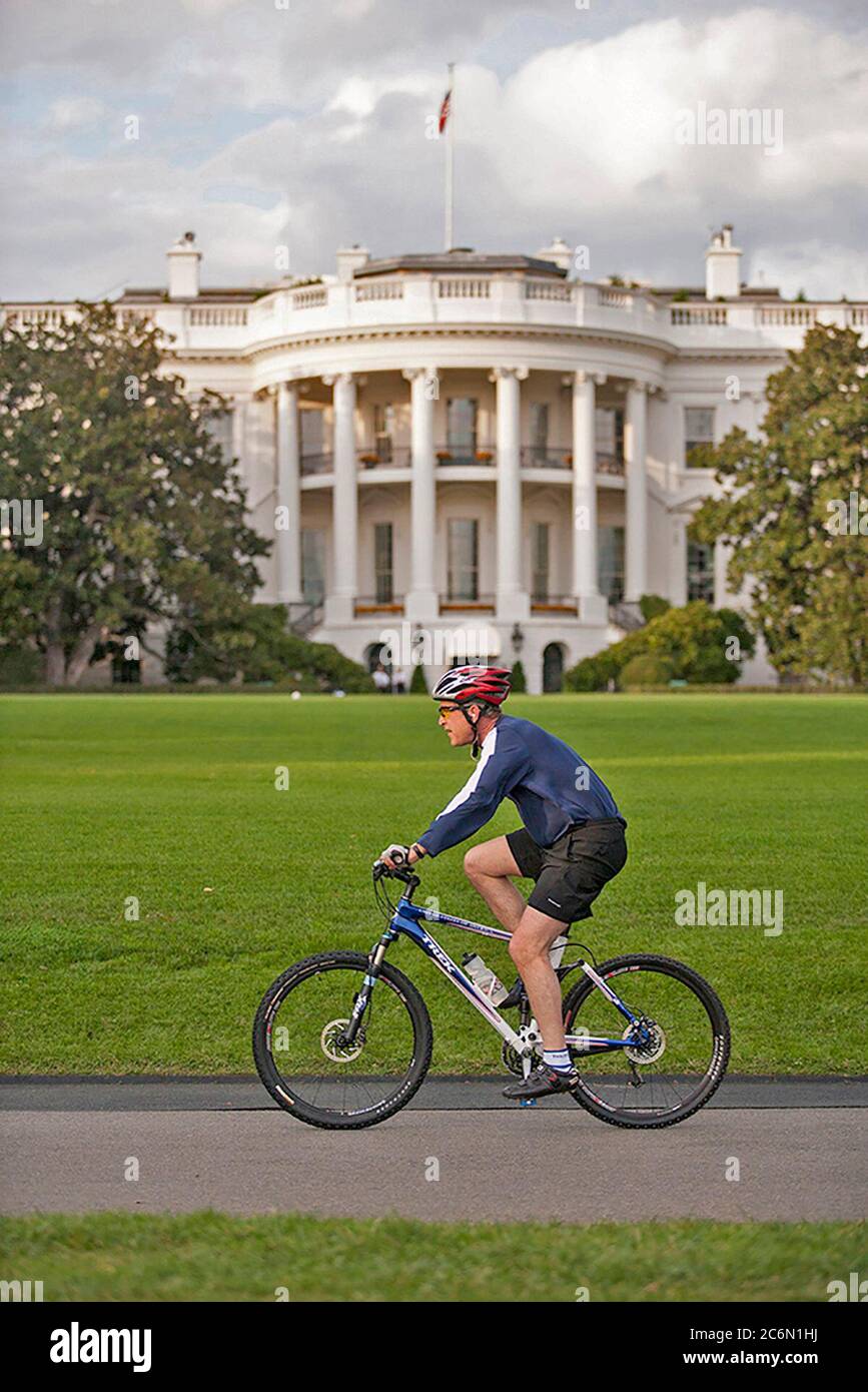 President George W. Bush rides a bike Nov. 1, 2006, on the South Lawn of the White House.  Photo by Eric Draper, Courtesy of the George W. Bush Presidential Library and Museum Stock Photo