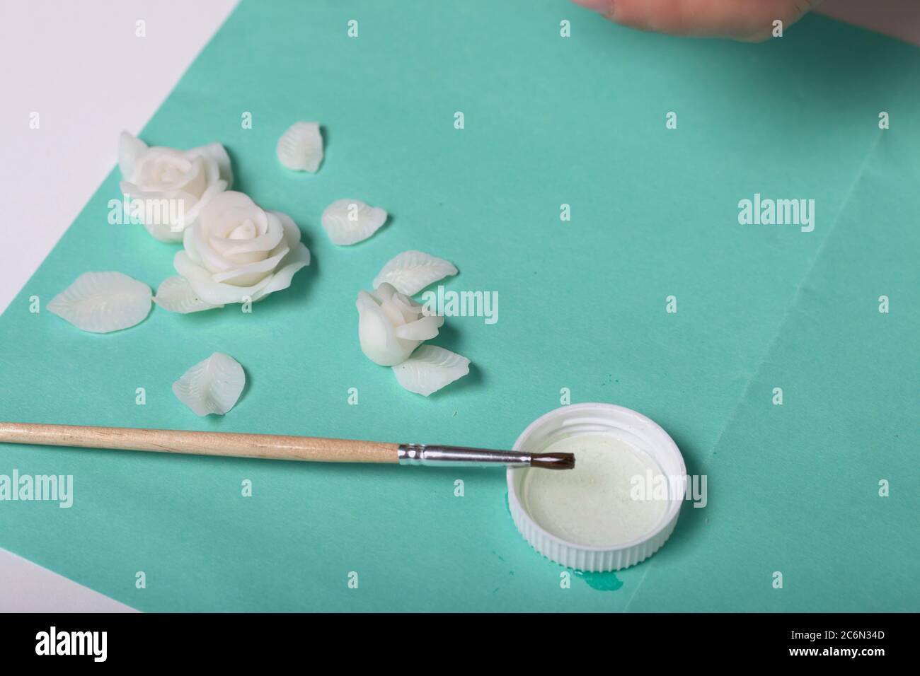 Roses with petals made of white polymer clay. Glue and brush. Crafts from polymer  clay Stock Photo - Alamy, image size:1300x956