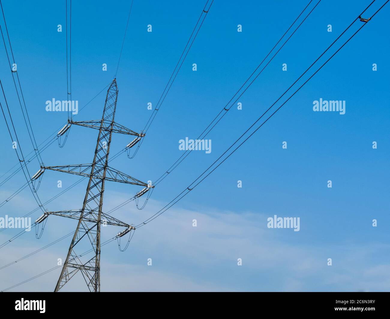 Electricity power supply pylon with a blue sky and clouds background ...