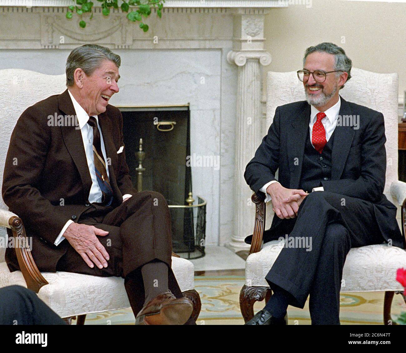 10/29/1987 President Reagan during a meeting with Judge Douglas Ginsburg, nominee to be Associate Justice of the United States Supreme Court in the Oval Office Stock Photo