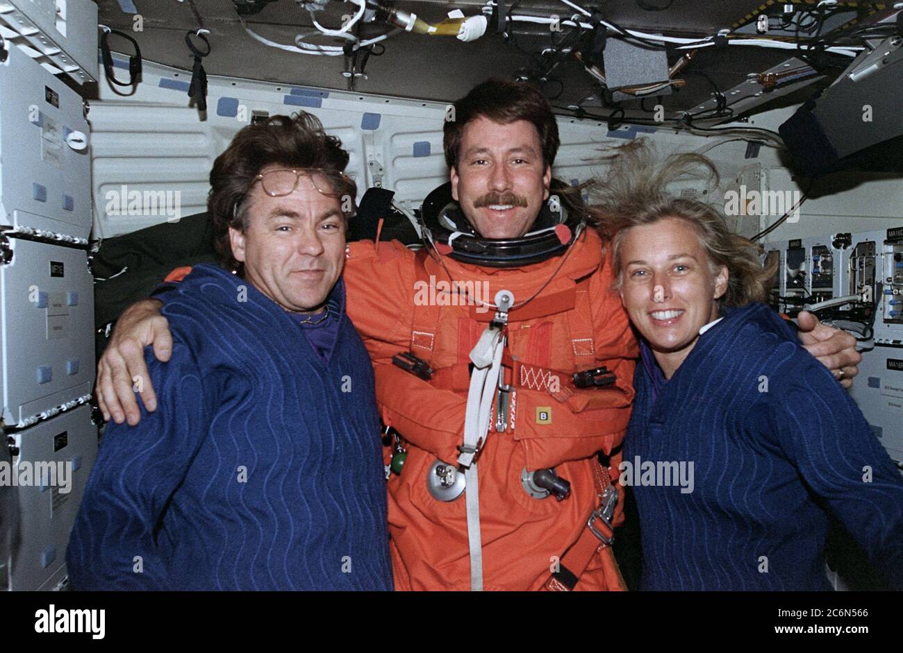 (19 August 1997) --- One of the final pictures taken during the STS-85 mission was this frame, exposed on the mid-deck during preparations for the August 19, 1997 entry.  Left to right are payload specialist Bjarni V. Tryggvason, with astronauts Kent V. Rominger, pilot, and N. Jan Davis, payload commander. Stock Photo