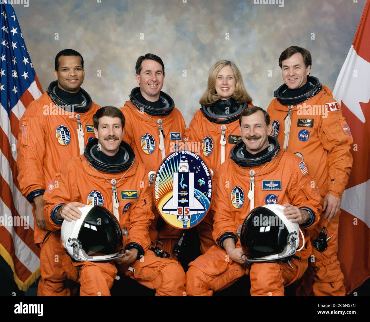 (May 1997) --- Five NASA astronauts and a Canadian payload specialist pause from their training schedule to pose for the traditional crew portrait for their mission. In front are astronauts Curtis L. Brown, Jr. (right), mission commander, and Kent V. Rominger, pilot. On the back row, from the left, are astronauts Robert L. Curbeam, Jr., Stephen K. Robinson and N. Jan Davis, all mission specialists, along with the Canadian Space Agency's (CSA) payload specialist Bjarni Tryggvason. Stock Photo