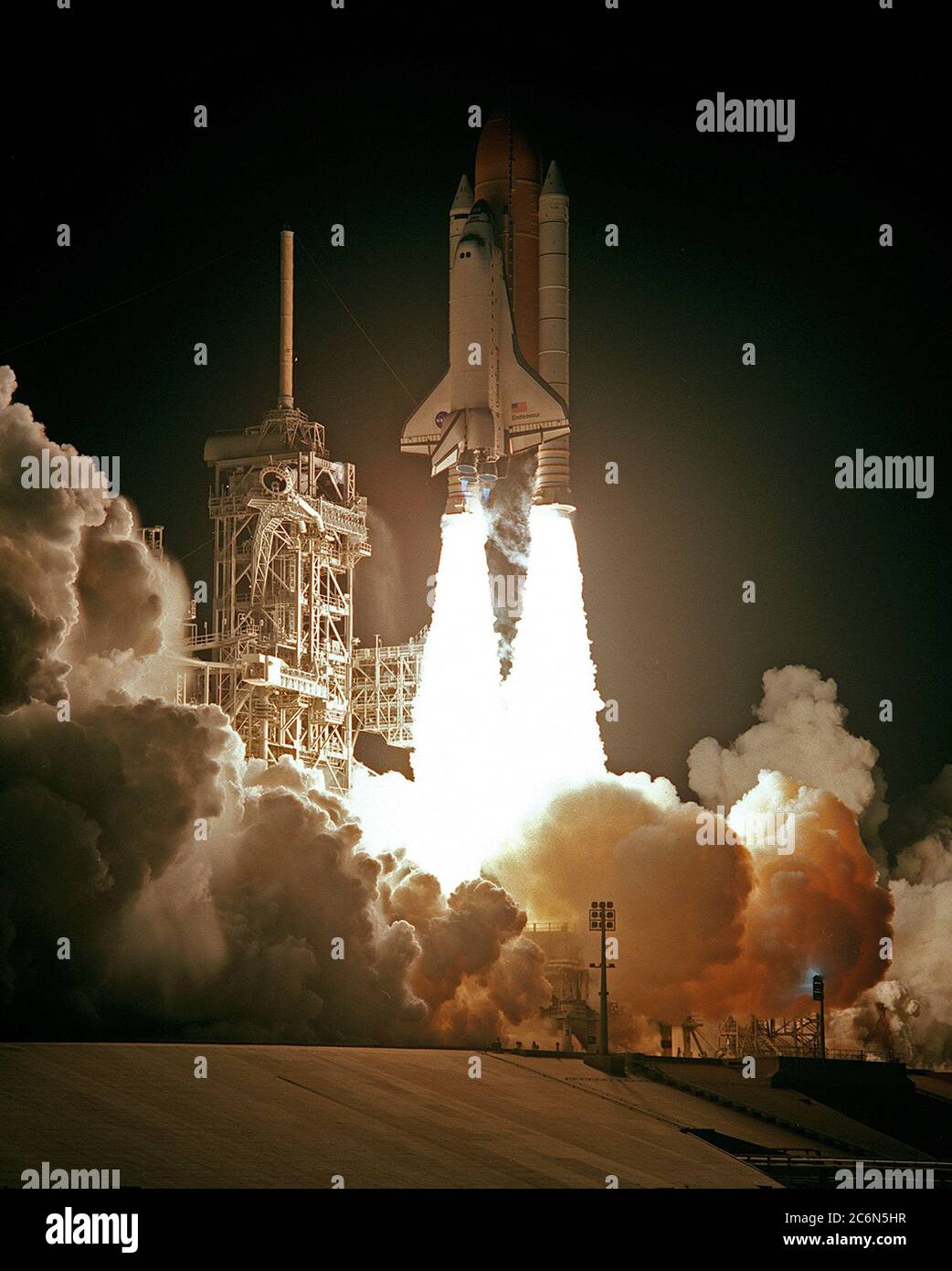 (4 Dec. 1998) --- The Space Shuttle Endeavour lights up the night sky as it embarks on the first mission dedicated to the assembly of the International Space Station (ISS).  Liftoff occurred at 3:35:34 a.m. (EST), December 4, 1998, from Launch Pad 39A, at the Kennedy Space Center (KSC), Florida.  Onboard were astronauts Robert D. Cabana, mission commander; Frederick W. Sturckow, pilot; Nancy J. Currie, Jerry L. Ross and James H. Newman, along with Russian Space Agency (RSA) cosmonaut Sergei K. Krikalev, all mission specialists. Stock Photo