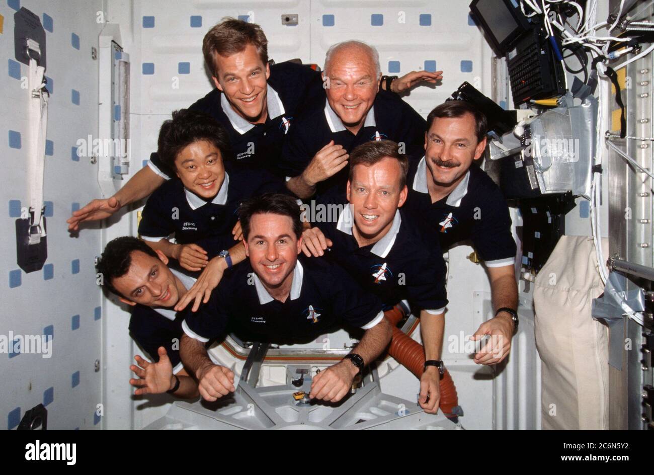 (29 Oct.-7 Nov. 1998) --- With their feet anchored in the hatchway, the seven STS-95 crew members pose for their traditional in-flight crew portrait. Astronaut Curtis L. Brown Jr., commander, appears at right center in the pyramid.  Others, clockwise from there, are Steven W. Lindsey, pilot; Stephen K. Robinson, mission specialist; Pedro Duque, mission specialist representing the European Space Agency (ESA); payload specialist Chiaki Naito-Mukai, who represents Japan's National Space Development Agency (NASDA); Scott E. Parazynski, mission specialist; and United States Senator John H. Glenn Jr Stock Photo