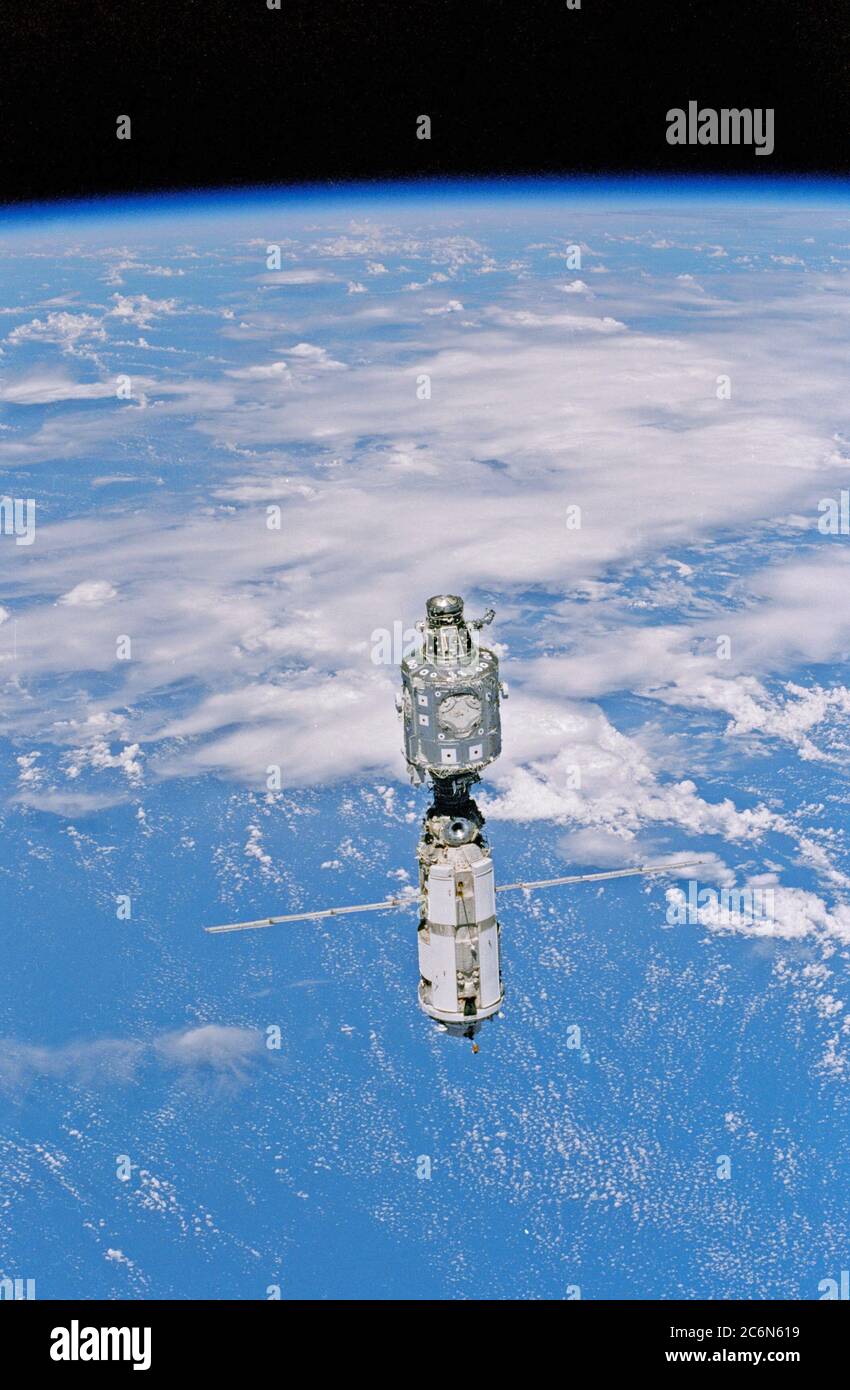 (3 June 1999) --- Backdropped against white clouds and blue ocean waters, the International Space Station (ISS) moves away from the Space Shuttle Discovery. The U.S.-built Unity node (left) and the Russian-built Zarya or FGB module (with the solar array panels deployed) were joined during a December 1998 mission. Stock Photo