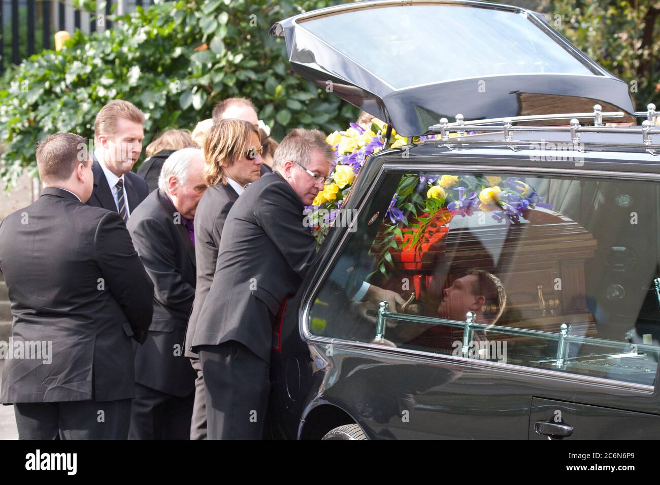 Keith Urban helps carry the coffin from St Francis Xavier Church to the ...