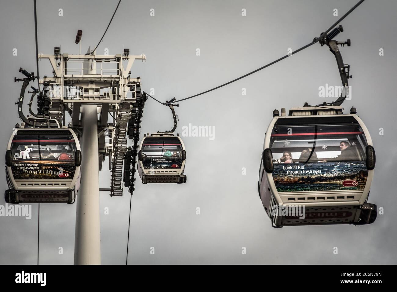 People in an Emirates Airline cable car crossing the Thames Stock Photo ...