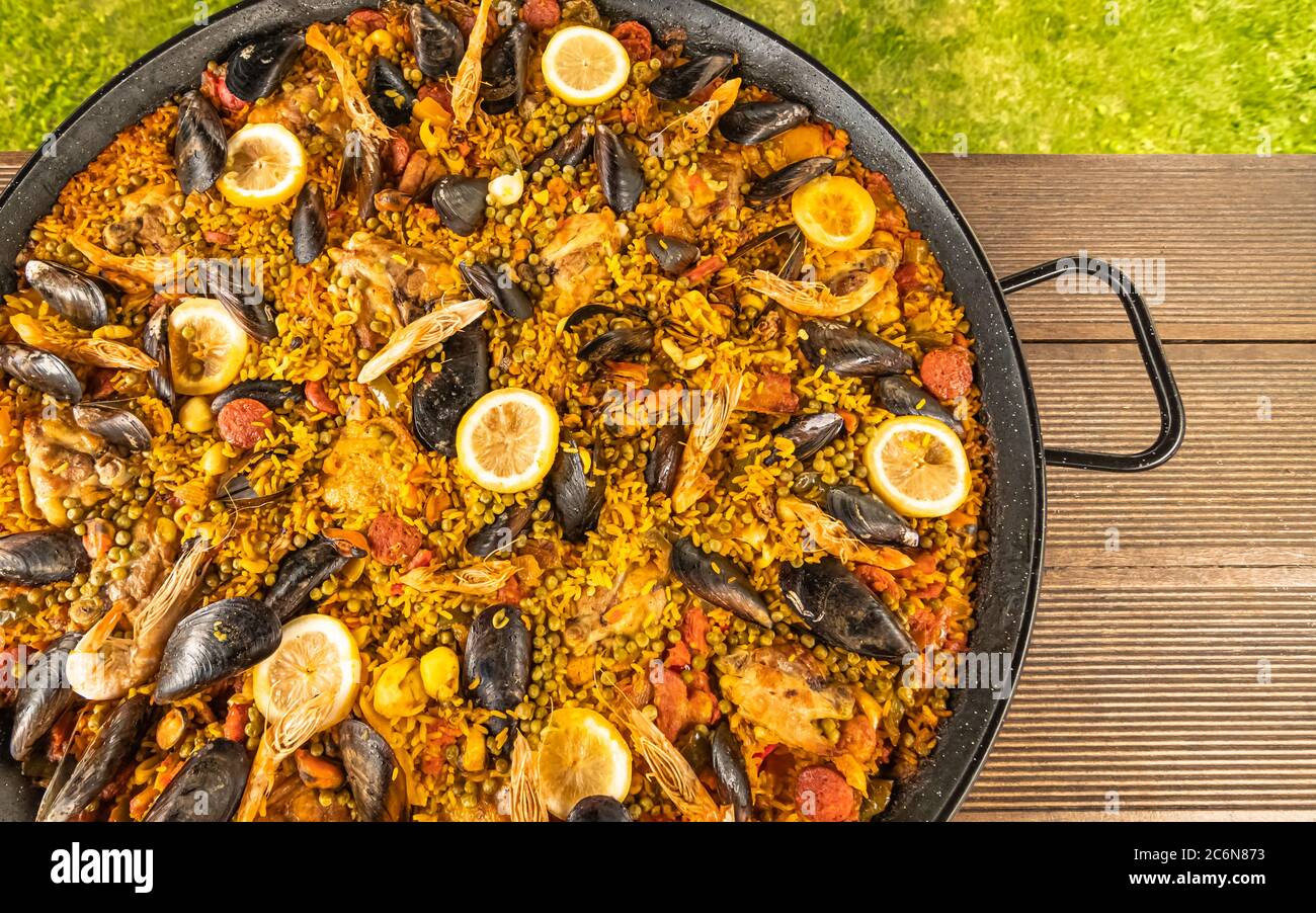 Paella dish with seafood, mussels, prawns, chicken, chorizo, rice
