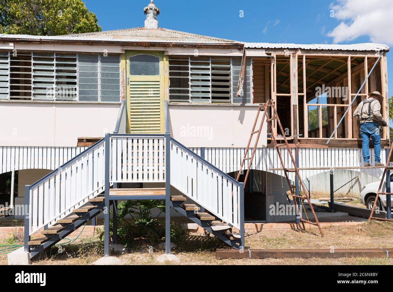Builder renovating old traditional Queenslander style high set home Stock Photo