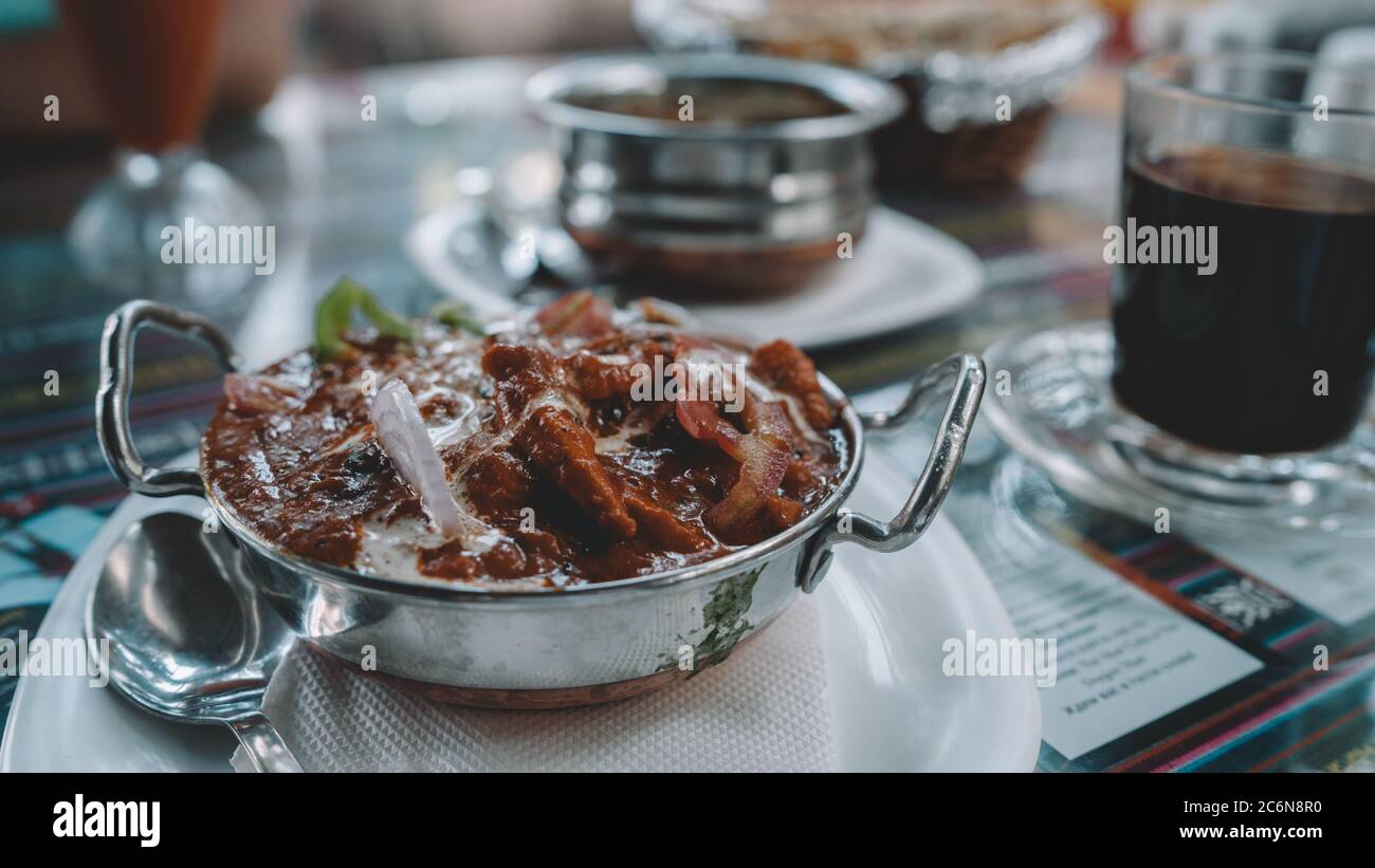 An Indian dish on the table in a tropical cafe. Stock Photo