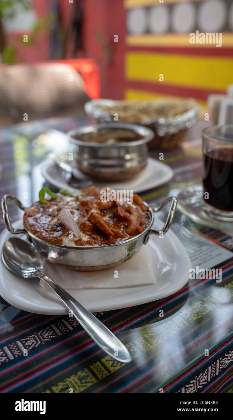 An Indian dish on the table in a tropical cafe. Stock Photo