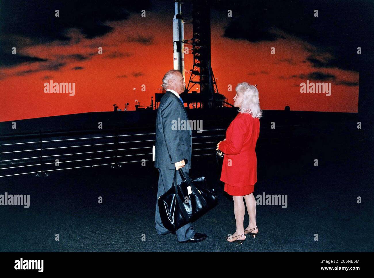 Apollo 11 Lunar Module Pilot Edwin E. 'Buzz' Aldrin, Jr. and his wife, Lois, stand before a painting of an Apollo/Saturn V launch vehicle at the pad in the new Apollo/Saturn V Center (ASVC) at KSC prior to the gala grand opening ceremony for the facility that was held Jan. 8, 1997. The astronauts were invited to participate in the event, which also featured NASA Administrator Dan Goldin and KSC Director Jay Honeycutt. The ASVC also features several other Apollo program spacecraft component displays and multimedia presentations. Stock Photo