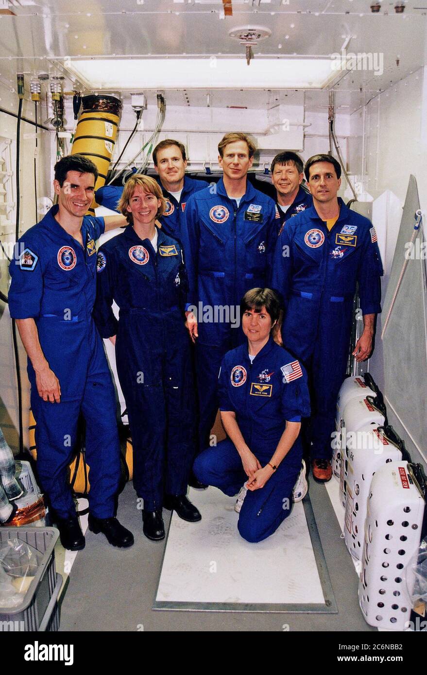 The STS-83 crew poses in the White Room at Launch Complex 39A during the crew's Terminal Countdown Demonstration Test (TCDT). From left to right, standing, they are Payload Specialist Gregory T. Linteris, Pilot Susan L. Still, Mission Commander James D. Halsell, Mission Specialist Michael L. Gernhardt, Payload Specialist Roger K. Crouch, and Mission Specialist Donald Thomas. Mission Specialist Janice E. Voss is kneeling Stock Photo