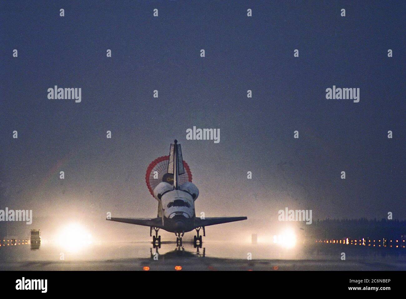 KENNEDY SPACE CENTER, FLA. -- With its drag chute deployed, the Space Shuttle  Orbiter Columbia touches down on Runway 33 at KSC’s Shuttle Landing Facility at  6:46:34 a.m. EDT  with Mission Commander  James D. Halsell Jr. and Pilot Susan L.  Still at the controls to complete the STS-94 mission. Also on board are Mission Specialist  Donald A. Thomas, Mission Specialist Michael L. Gernhardt , Payload Commander  Janice Voss, and Payload Specialists Roger  K.  Crouch and Gregory T. Linteris. Mission  elapsed time for STS-94 was 15 days,16 hours, 44 seconds. Stock Photo