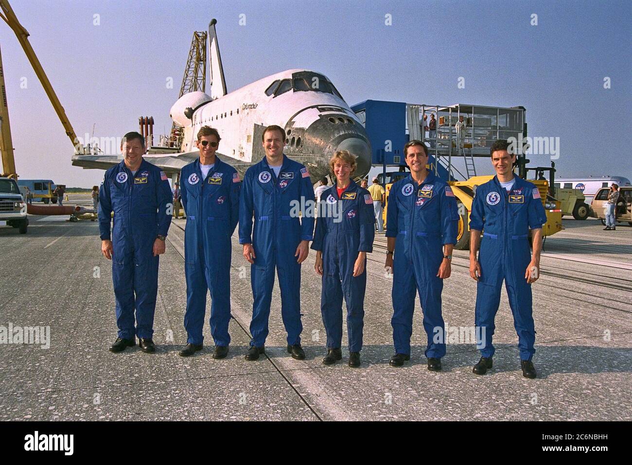KENNEDY SPACE CENTER, FLA. -- The STS-94 flight crew poses in front of the  Space Shuttle orbiter Columbia after an end-of-mission landing on Runway 33 at KSC’s  Shuttle Landing Facility July 17 to complete the Microgravity Science Laboratory-1  (MSL-1) mission. They are (from left): Payload Specialist Roger K. Crouch; Mission  Specialist Michael L. Gernhardt;  Mission Commander  James D. Halsell Jr.; Pilot Susan  L. Still; Mission Specialist Donald A. Thomas; and Payload Specialist Gregory T.  Linteris Stock Photo
