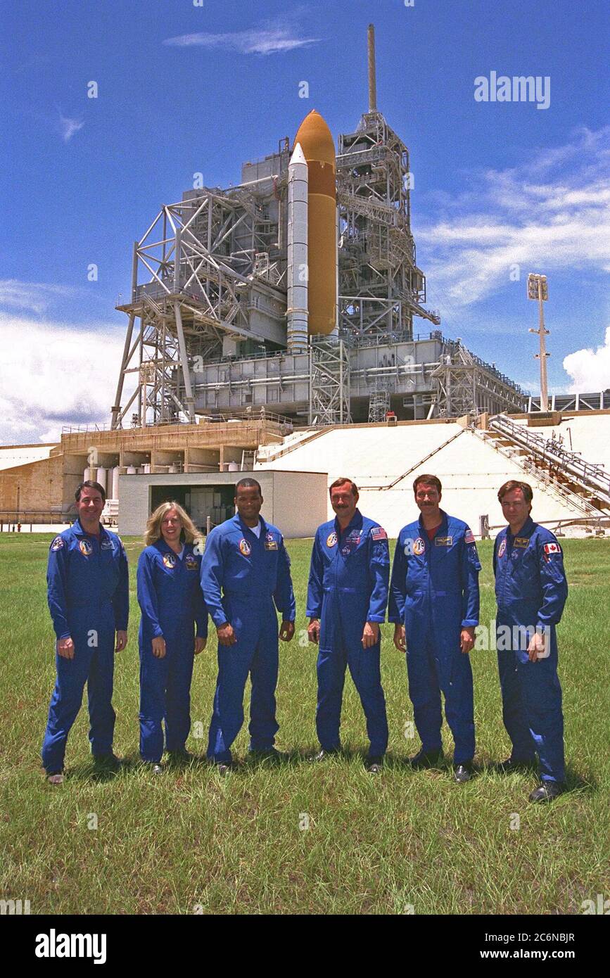 KENNEDY SPACE CENTER, Fla. -- The STS-85 flight crew poses in front of the  Space Shuttle Discovery at Launch Pad 39A during a break in Terminal Countdown  Demonstration Test (TCDT) activities for that mission. They are (from left): Mission  Specialist Stephen K. Robinson; Payload Commander N. Jan Davis; Mission Specialist  Robert L. Curbeam, Jr.; Commander Curtis L. Brown, Jr.;  Pilot Kent V. Rominger; and  Payload Specialist Bjarni V. Tryggvason. Stock Photo