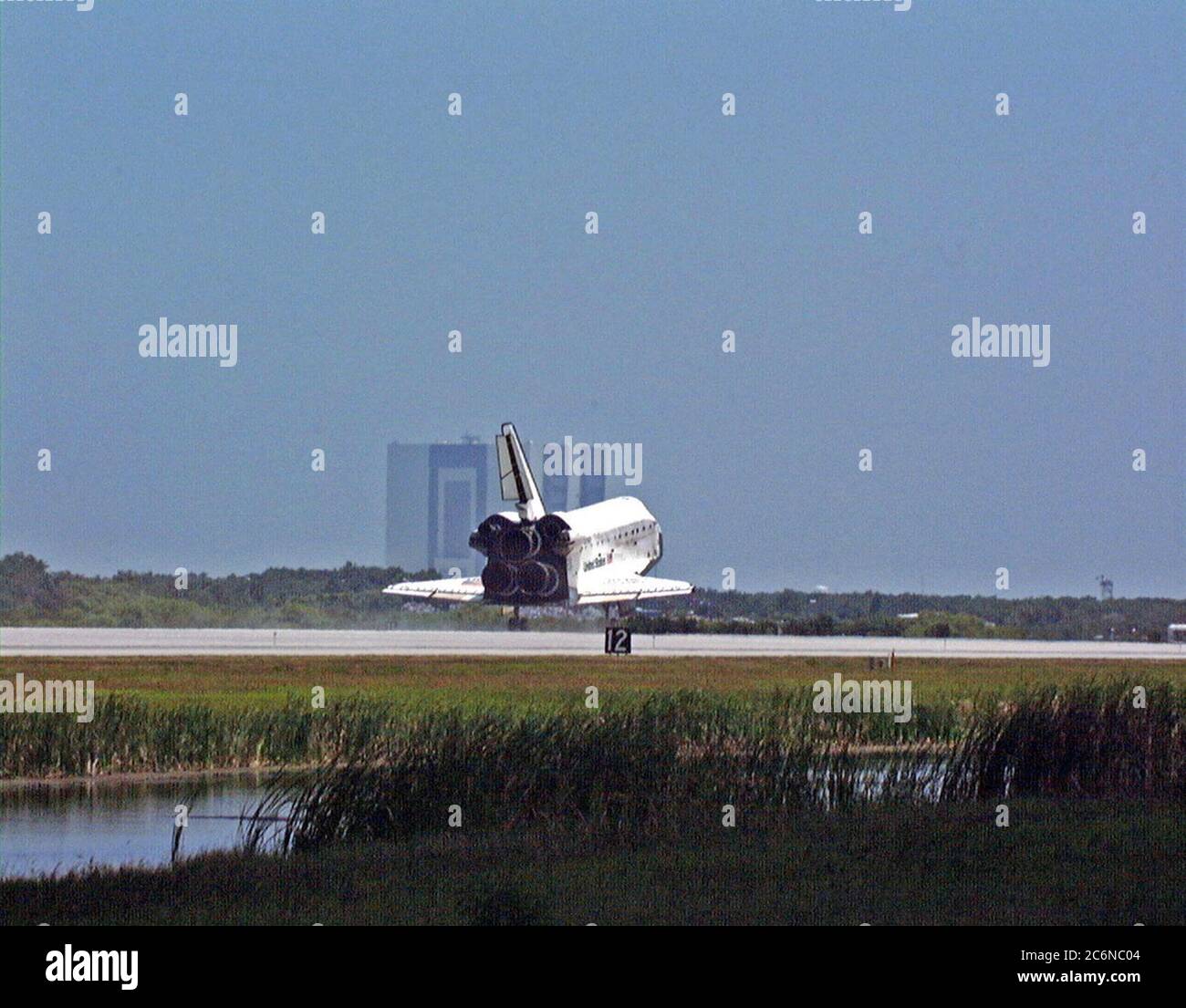 With the 525-foot-tall Vehicle Assemble Building as backdrop, the orbiter Discovery touches down on Runway 15 of KSC's Shuttle Landing Facility to complete the STS-91 mission. Main gear touchdown was at 2:00:18 p.m. EDT on June 12, 1998, landing on orbit 155 of the mission. The wheels stopped at 2:01:22 p.m. EDT, for a total mission-elapsed time of 9 days, 19 hours, 55 minutes and 1 second. Stock Photo