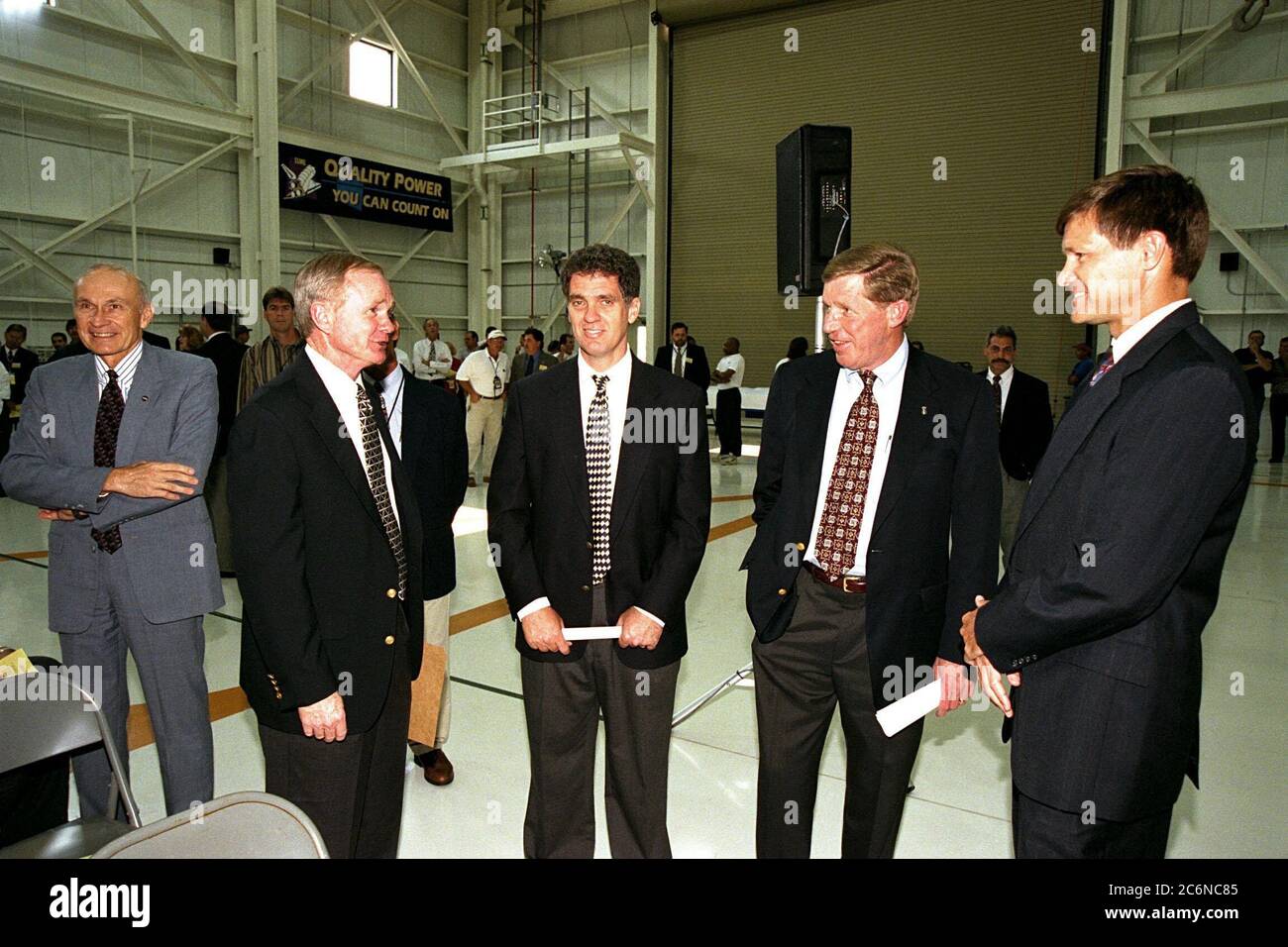 Participants in the ribbon cutting for KSC's new 34,600-square-foot Space Shuttle Main Engine Processing Facility (SSMEPF) gather to talk inside the facility following the ceremony. From left, they are Robert B. Sieck, director of Shuttle Processing; KSC Center Director Roy D. Bridges Jr.; U.S. Congressman Dave Weldon; John Plowden, vice president of Rocketdyne; and Donald R. McMonagle, manager of Launch Integration. Stock Photo