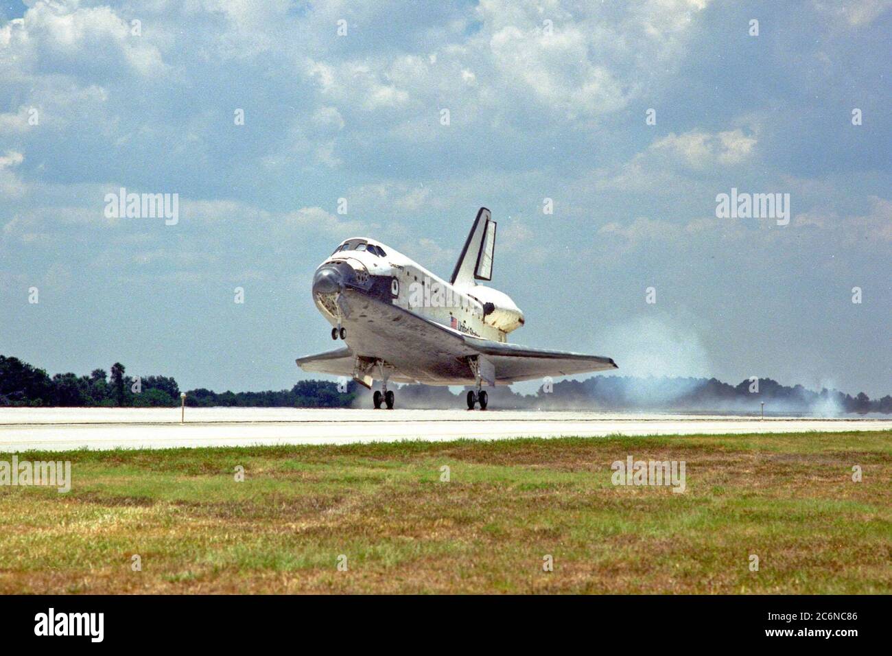 KENNEDY SPACE CENTER, FLA. -- The orbiter Discovery touches down on Runway 15 of KSC's Shuttle Landing Facility to complete the STS-91 mission. Main gear touchdown was at 2:00:18 p.m. EDT on June 12, 1998, landing on orbit 155 of the mission. The wheels stopped at 2:01:22 p.m. EDT, for a total mission-elapsed time of 9 days, 19 hours, 55 minutes and 1 second. Stock Photo