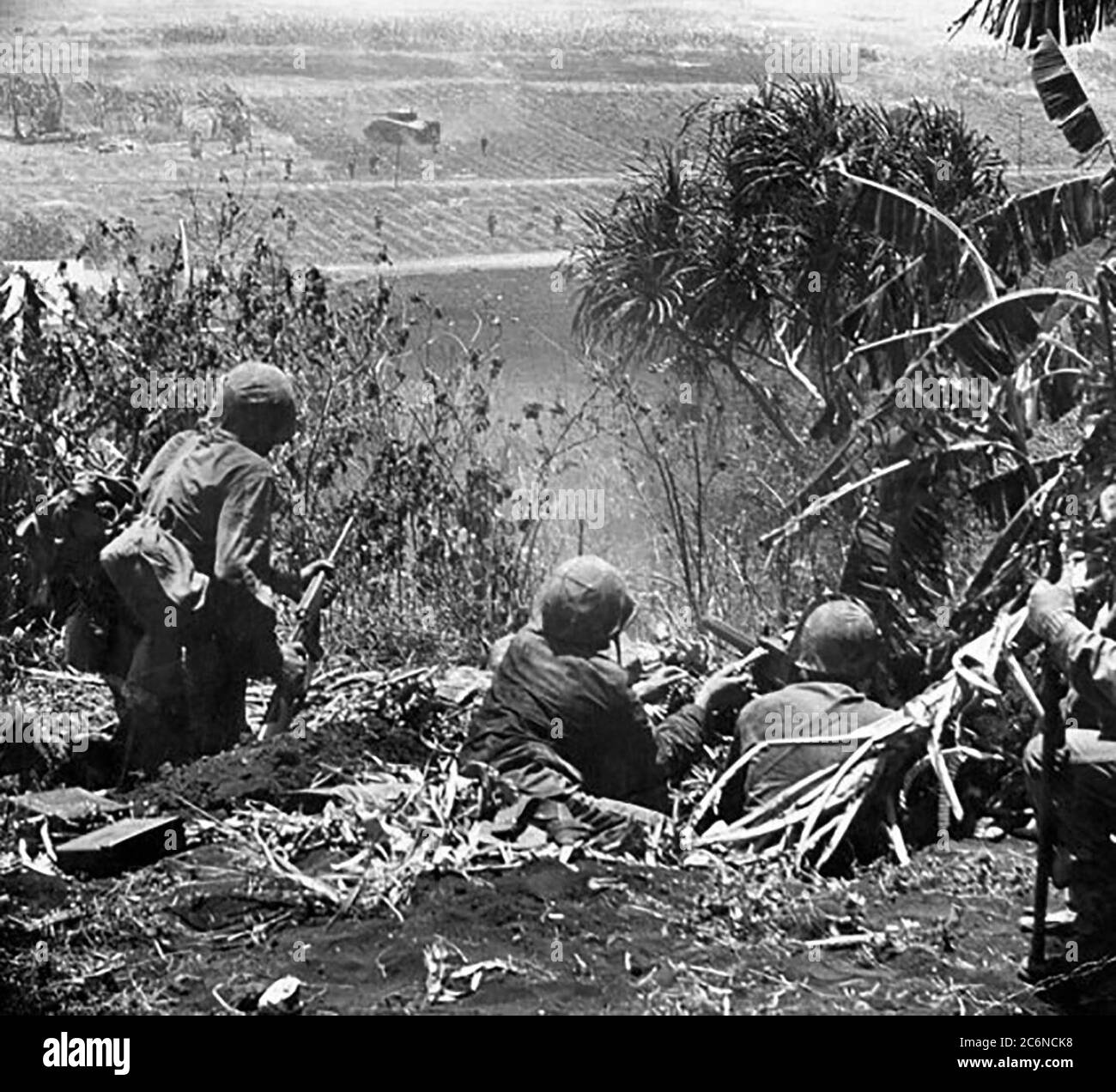 U.S. Marines engage in fierce fighting with Imperial Japanese forces during the Battle of Saipan in World War Two ca. 1944 Stock Photo