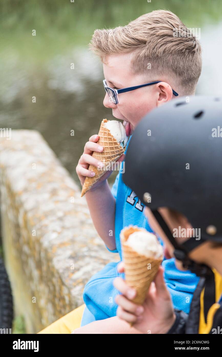 Young boys enjoying an ice cream. Stock Photo