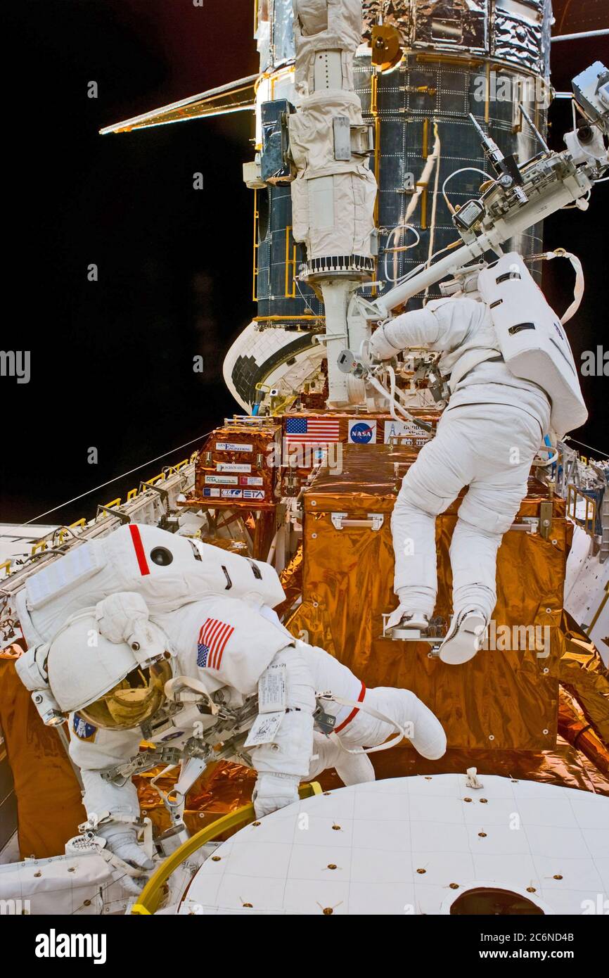 (14 Feb. 1997) --- Astronaut Mark C. Lee, STS-82 payload commander (in foreground) and Steven L. Smith during Extravehicular Activity (EVA) setup.  This view was taken with an Electronic Still Camera (ESC). Stock Photo