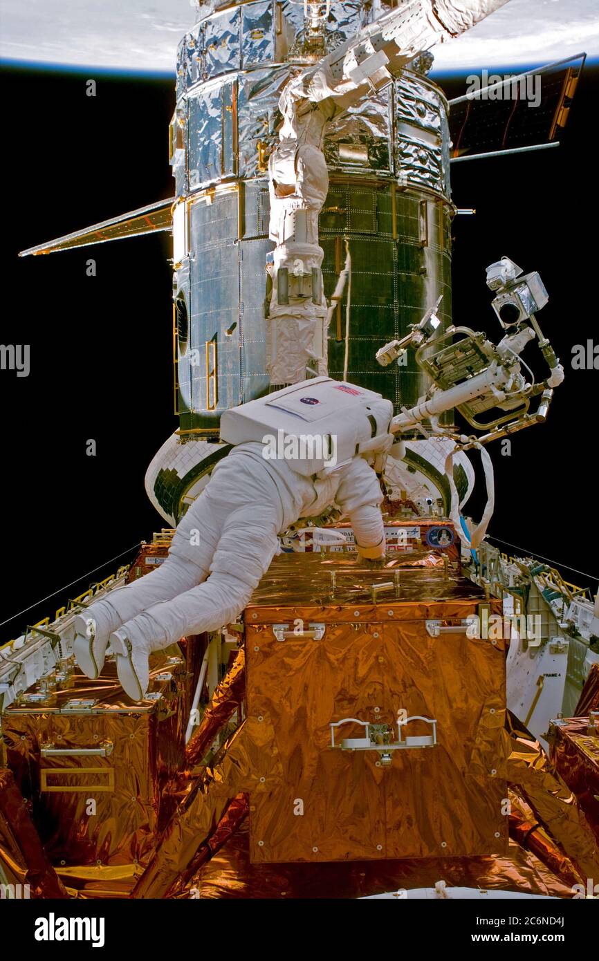 (14 Feb. 1997) --- Astronaut Steven L. Smith, STS-82 mission specialist, during Extravehicular Activity (EVA) setup, for the Hubble Space Telescope (HST) repair.  This view was taken with an Electronic Still Camera (ESC). Stock Photo