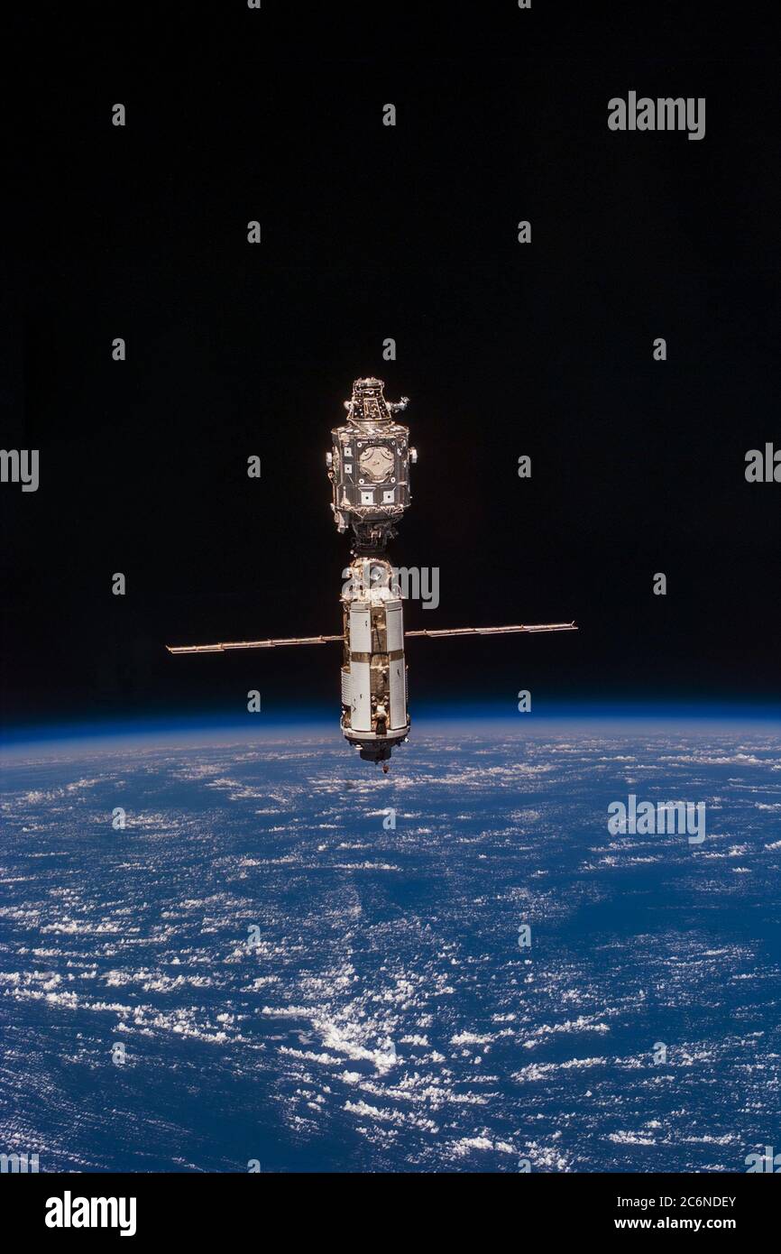 (03 June 1999) --- The International Space Station (ISS) is backdropped against the blue and white  horizon scene of Earth and the blackness of space following separation from Discovery. Stock Photo