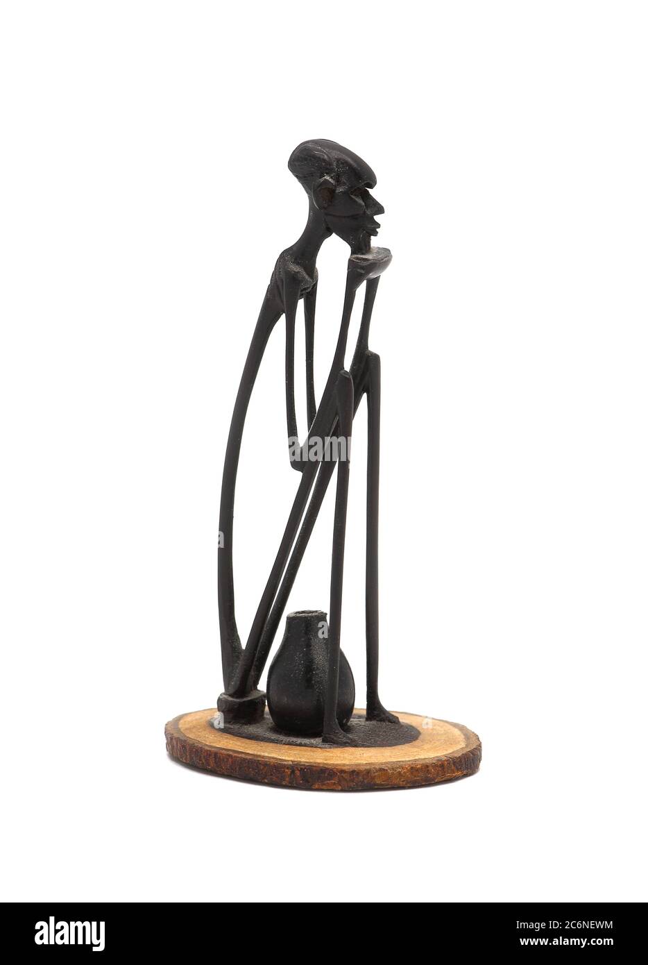 Wooden miniature ebony figurine on a light background in an unusual design. The work of an unknown master. Souvenir. East Africa, July 11, 2020. Stock Photo