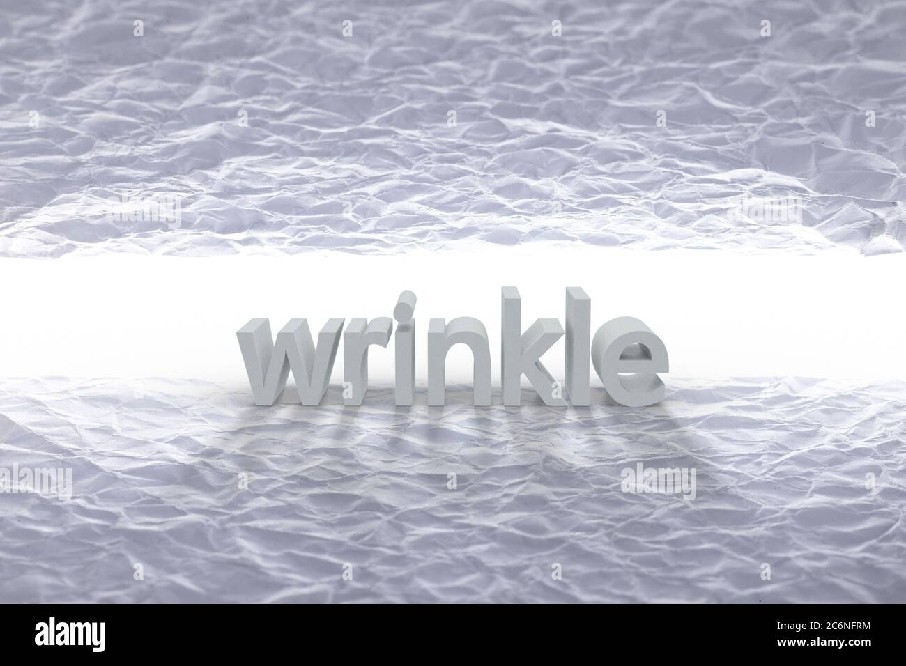 Alphabet wrinkle word block with wrinkled paper background. Stock Photo